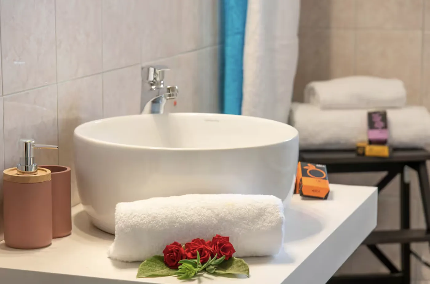 Bathroom with vessel sink and fresh towels at Villa Morea